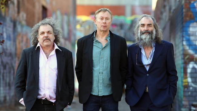 Melbourne-born instrumental trio Dirty Three, pictured in 2019. L-R: Jim White (drums), Mick Turner (guitar) and Warren Ellis (violin). Picture: Aaron Francis