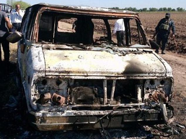 The burnt out van of Dean Lucas and Adam Coleman who went missing while surfing in Mexico.