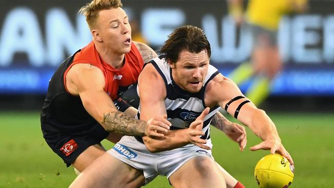 James Harmes tackles Patrick Dangerfield.