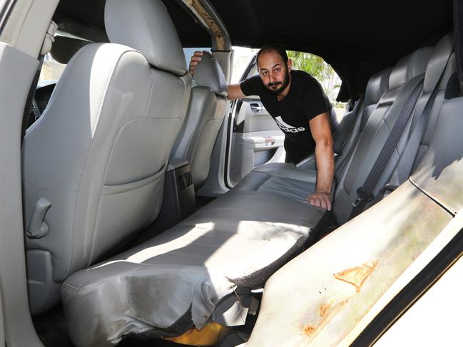 A crime spree overnight starting around Bundall resulted in widespread damage to cars and property and a man being stabbed in the throat. Sorrento resident Albert Doumit surveys the damage to his cars in Balmoral Ave...Picture Glenn Hampson