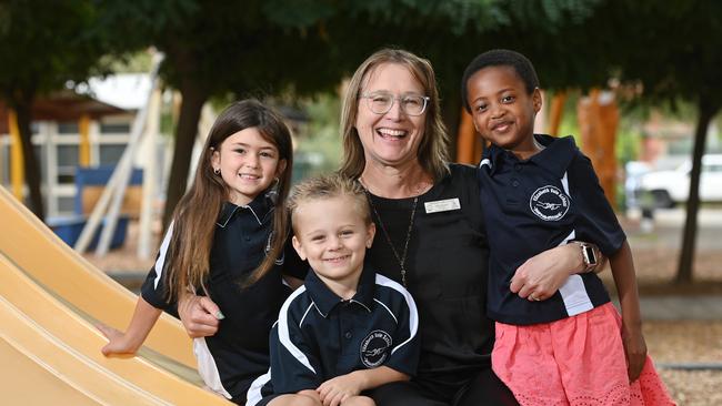 Elizabeth Vale Primary School principal Julie Murphy with Lily Byrt (6), Truphena Singirankabo (6), Harrison Rigney (5). Picture: Keryn Stevens