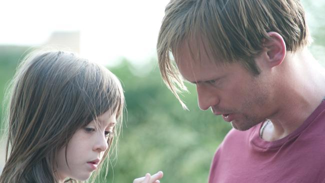 Alexander Skarsgaard (right) and Onata Aprile in a scene from film What Maisie Knew.