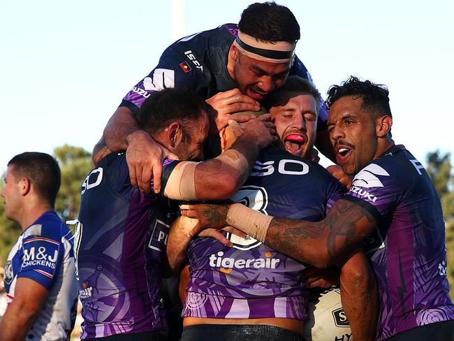 SYDNEY, AUSTRALIA - MAY 26: Will Chambers of the Storm celebrates scoring a try with team mates during the round 11 NRL match between the Canterbury Bulldogs and the Melbourne Storm at Belmore Sports Ground on May 26, 2019 in Sydney, Australia. (Photo by Cameron Spencer/Getty Images)