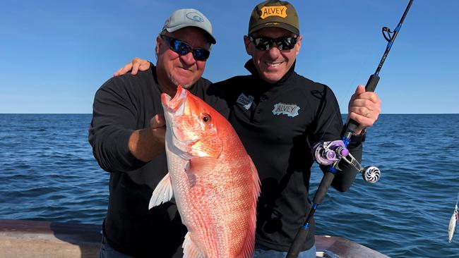 Alvey Reels director Con Athans (right) testing out the brand's new overhead reel in Brownsville Texas with Charlie Guillen.