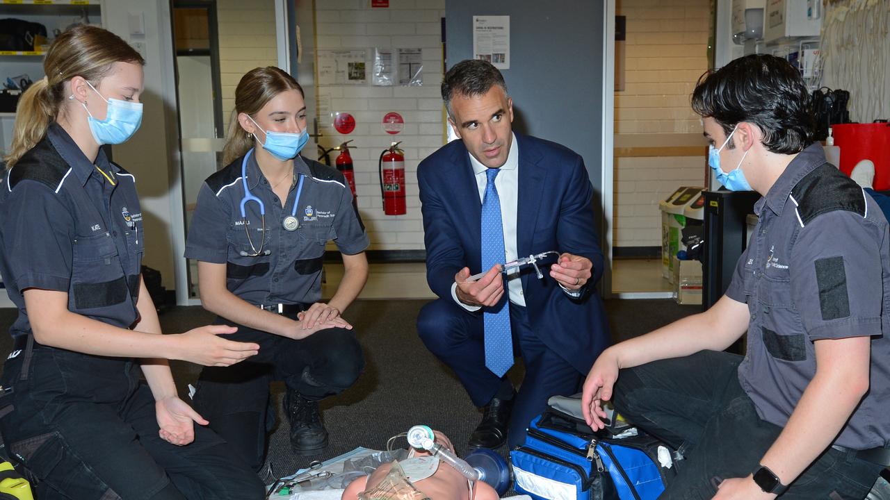 Flinders University paramedic students Kate McKellar-Stewart, Maali von der Borch and Alex Georgonicas) with Labor leader Peter Malinauskas. Picture: Michael Marschall