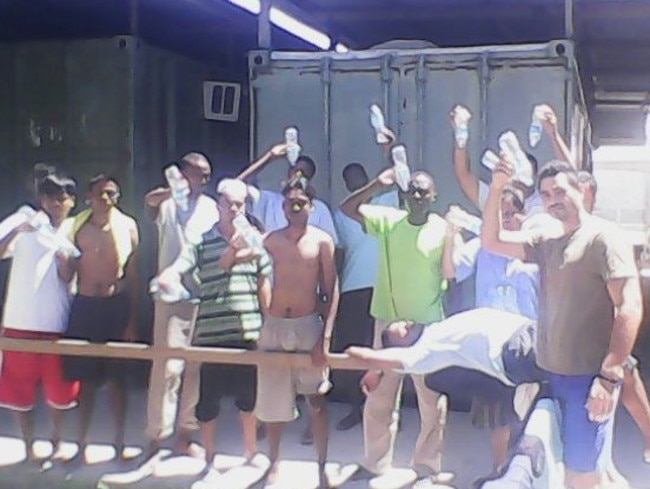 Empty bottles ... asylum seekers at the Manus Island Detention Centre. Picture: Refugee Action Coalition