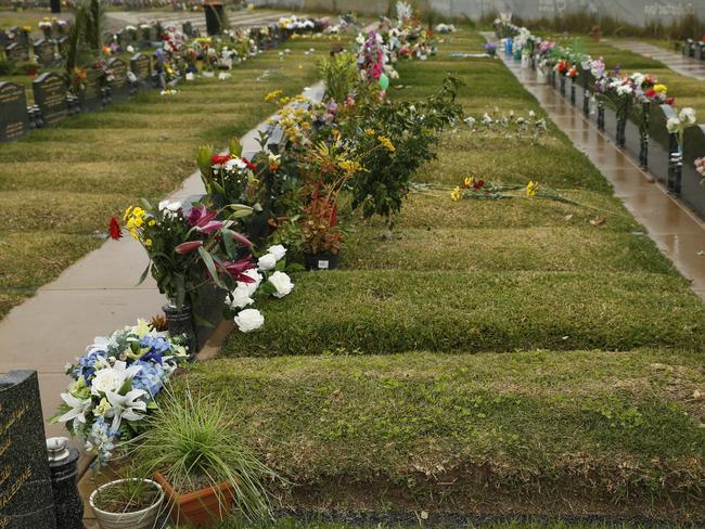 Farhad Jabar’s unmarked grave (foreground with blue and white flowers in lieu of a headstone) as it is today in the Islamic section. Picture: David Swift