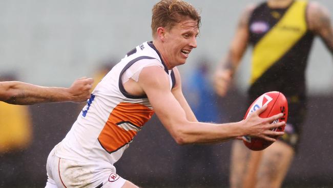 MELBOURNE, AUSTRALIA - JULY 14: Lachie Whitfield of the Giants runs with the ball during the round 17 AFL between the Richmond Tigers and the Greater Wester Giants at Melbourne Cricket Ground on July 14, 2019 in Melbourne, Australia. (Photo by Michael Dodge/Getty Images)