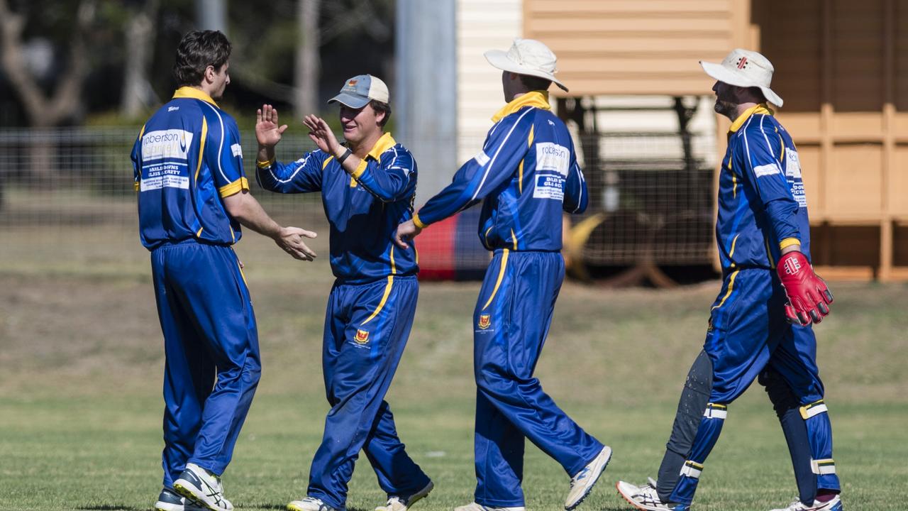 University celebrate the dismissal of Highfields player Ben Anderson, caught Tully Wilson (centre) bowled Matt Johnston (left). Picture: Kevin Farmer