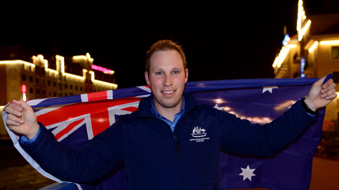 Cameron Rahles-Rahbula with the Australian flag after been given the honour as the Flag Bearer for the opening ceremony at the Russia Paralympics. Photo: Jeff Crow