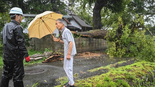 Authorities issued high alerts, advising mass evacuations; 59 injuries and widespread power outages reported. Picture: AFP