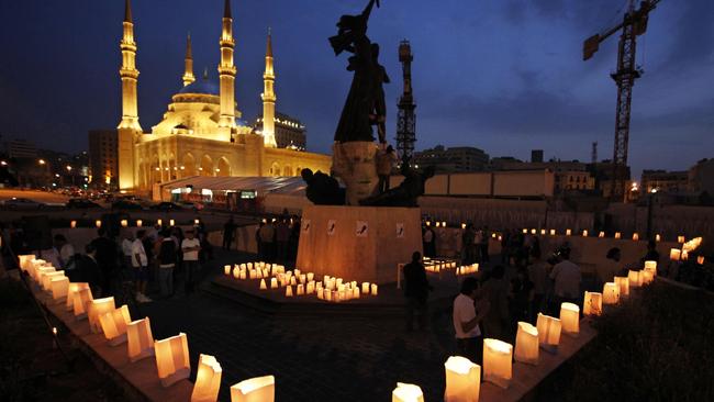 13/04/2009 WIRE: Lebanese light candles during a vigil marking the 34th anniversary of the 1975-90 civil war and to honor the victims of that war, at the Martyrs square in downtown of Beirut, Lebanon, on Monday April 13, 2009. When the Lebanese civil war ended in 1990, the toll was colossal: 150,000 people killed, about half a million wounded and nearly a similar number displaced. One quarter of the population, or about 900,000 people, had left the tiny Arab country. (AP Photo/Bilal Hussein)