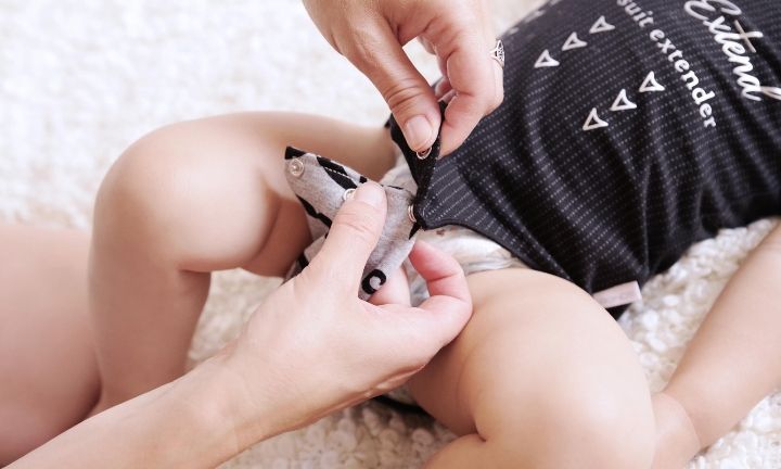 DIY budget hack: Mum sews bodysuit 'extenders' to make baby clothes last