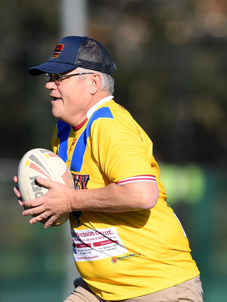 Scott Morrison joined a rugby league drill with students from the Clontarf Academy at Endeavour Sports High School in Sydney in 2018.