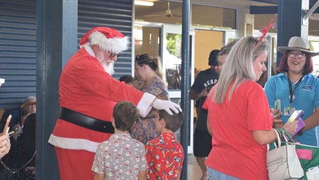 Santa greets excited children at the Proserpine Community Christmas Market on Sunday, December 13. Photo: Elyse Wurm
