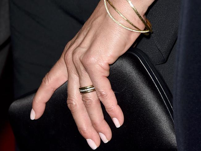 Aniston showed off her gold wedding ring.