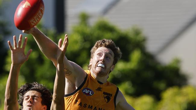 MELBOURNE, AUSTRALIA. February 15, 2024. AFL. Hawthorn Intraclub practise match at Waverley Park. Denver Grainger-Barras of the Hawks spoils from behind. Pic: Michael Klein