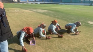 Four women help prepare the wicket at Rajkot, India ahead of Aus v india ODI.