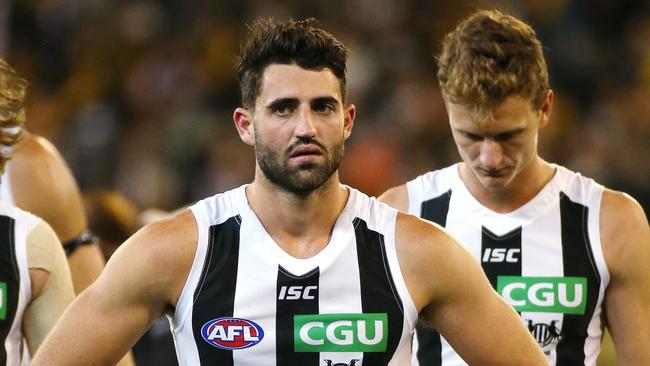 Alex Fasolo walks off the ground after Collingwood’s loss. Picture: George Salpigtidis