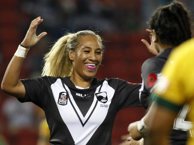 Atawhai Tupaea of the Kiwi Ferns celebrates a try against the Jillaroos.