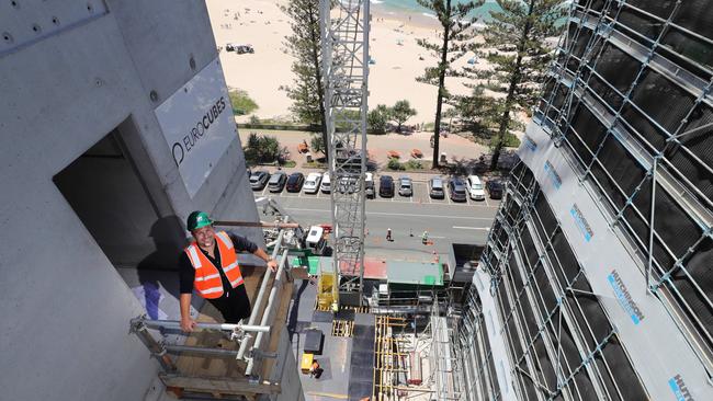 Developer David Calvisi at the top of the Luna tower lift well at the Burleigh beachfront with his Norfolk development rising to the right. He has achieved $100 million in pre-sales across both sites. Picture Glenn Hampson