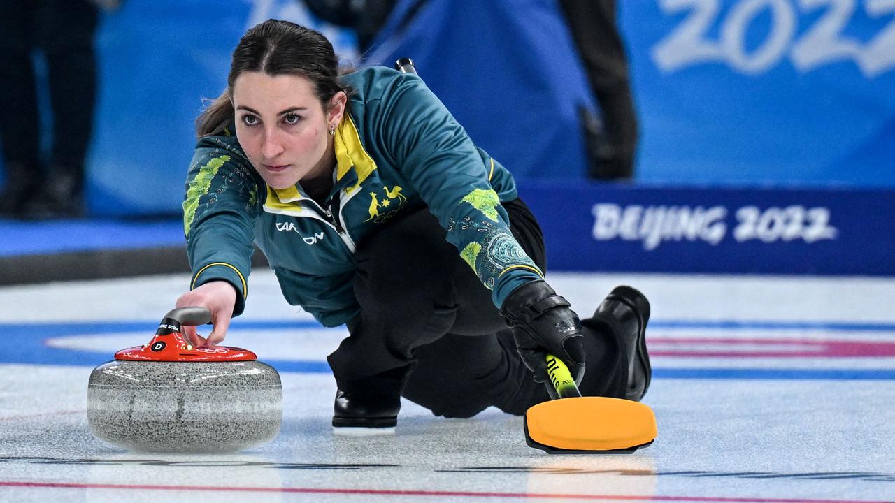 Australia's Tahli Gill curls the stone during the mixed doubles round robin session 8 game of the Beijing 2022 Winter Olympic Games curling competition between Australia and Italy, at the National Aquatics Centre in Beijing on February 5, 2022. (Photo by Lillian SUWANRUMPHA / AFP)