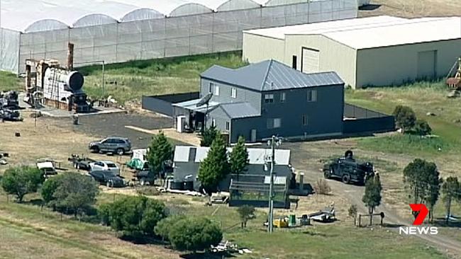 Police and Special Operations Group on the scene at a Lara property raid. Image: Channel 7