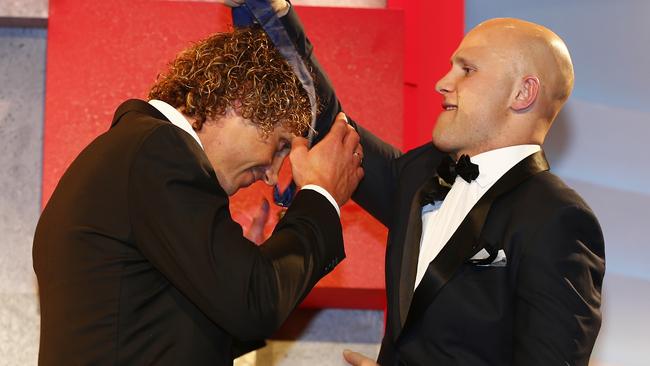 Gary Ablett hangs the Brownlow Medal around Matt Priddis’s neck. Picture: Michael Klein