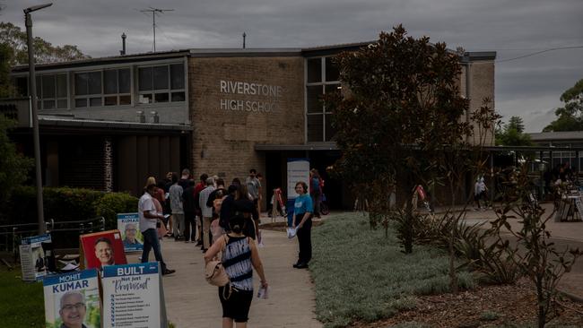 Voters file into Riverstone High School for 2023 NSW Election. Picture: Nathan