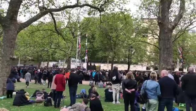 Crowds await patently on the historic Mall in London before funeral proceedings for Queen Elizabeth II get underway.