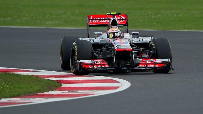 Britain's Lewis Hamilton driving a McLaren-Mercedes keeps control of his car at the British Grand Prix at Silverstone.