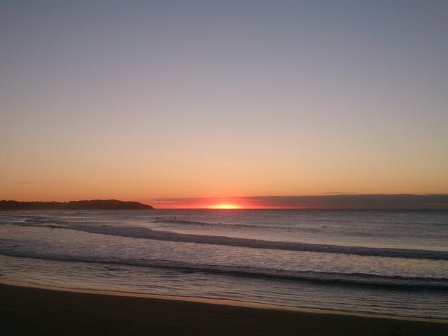 Is it a UFO or is the sun rising ... a possible sighting off Dee Why on Sydney’s northern beaches.