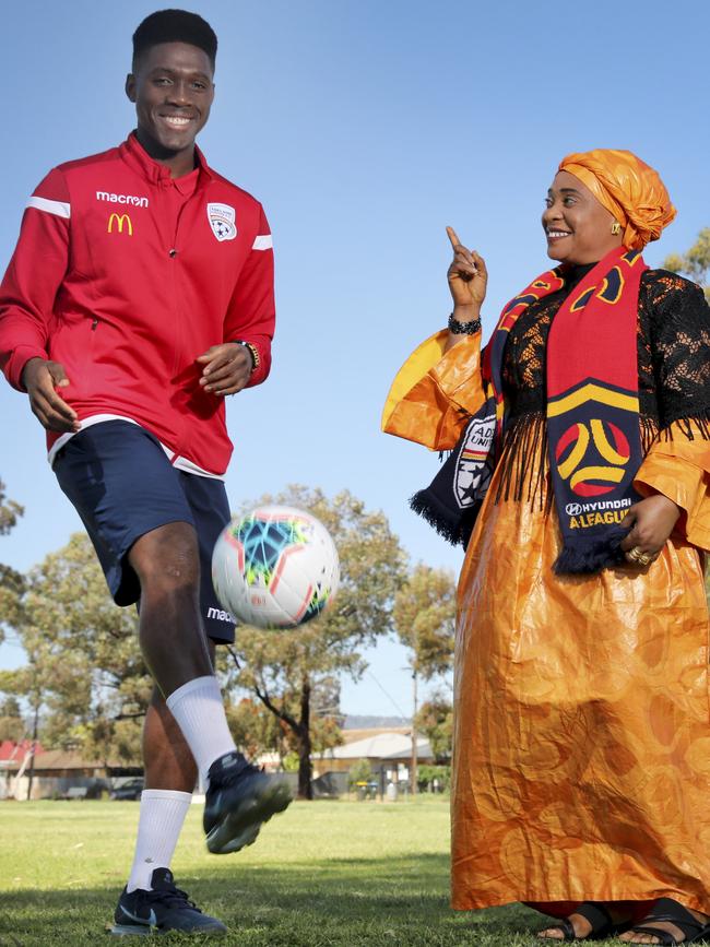 African-born teenager Al Hassan Toure,19, has scored four goals in his first three Adelaide United first-team games. Pictured with his mother, Mawa, who he credits for his success. 26 September 2019. Picture Dean Martin