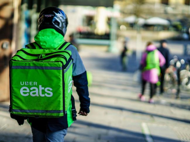 Gothenburg, Sweden - April 11, 2019: Uber eats delivery person carrying food to people who order by online app