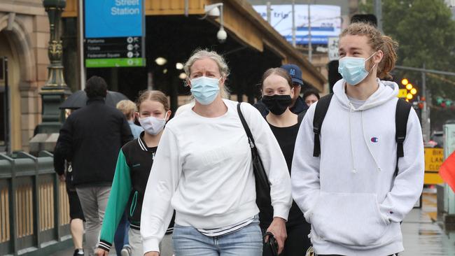 Masks are still mandatory indoors in Melbourne. Picture: David Crosling.