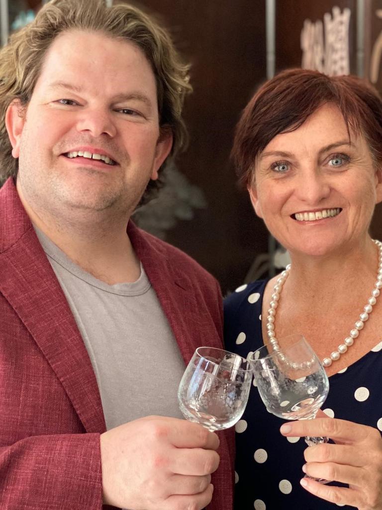 Toasting a bright new opportunity selling old wares in Peregian are business partners Chris Hughes and Simone Milasas.