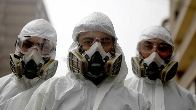 Health workers in Beirut as the army and security forces are called in to keep people at home. Picture; AFP.