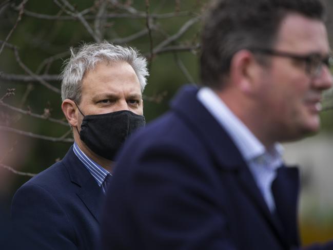 Victoria’s chief health officer Brett Sutton watches on as Premier Daniel Andrews addresses the media today. Picture: NCA NewsWire / Paul Jeffers