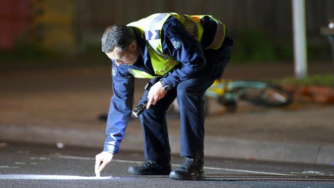 A police officer investigates the crash scene last night. Photo: Patrick Herve