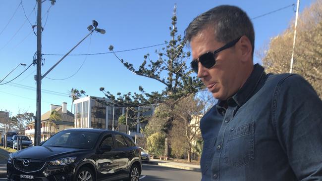 Former Surf Life Saving NSW boss Matthew Hanks leaves Wollongong police station. Pic Madeline Crittenden