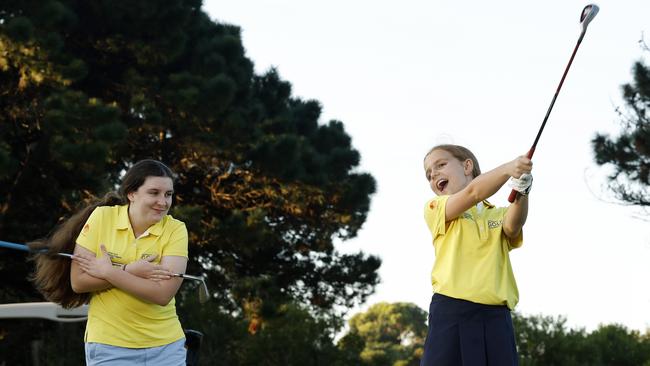 DAILY TELEGRAPH MARCH 19, 2024. Young golfers Elizabeth Savell, 14, (left) and Eliza Rolfe, 9, during a lesson at East Lakes Golf Club in Pagewood. Picture: Jonathan Ng