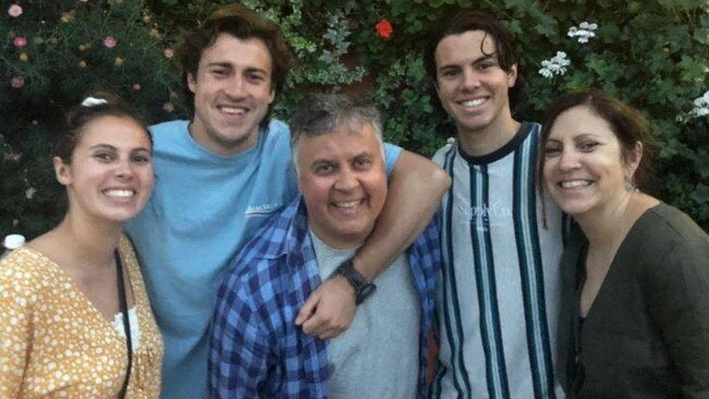 Andrew McGrath with his dad Mike and family.