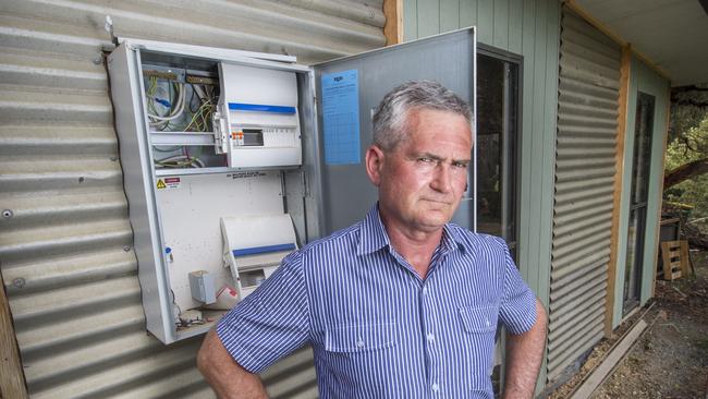 Richard Morris’ power was cut by AusNet Services after he refused to pay to have an overhead powerline placed underground. Picture: Rob Leeson.