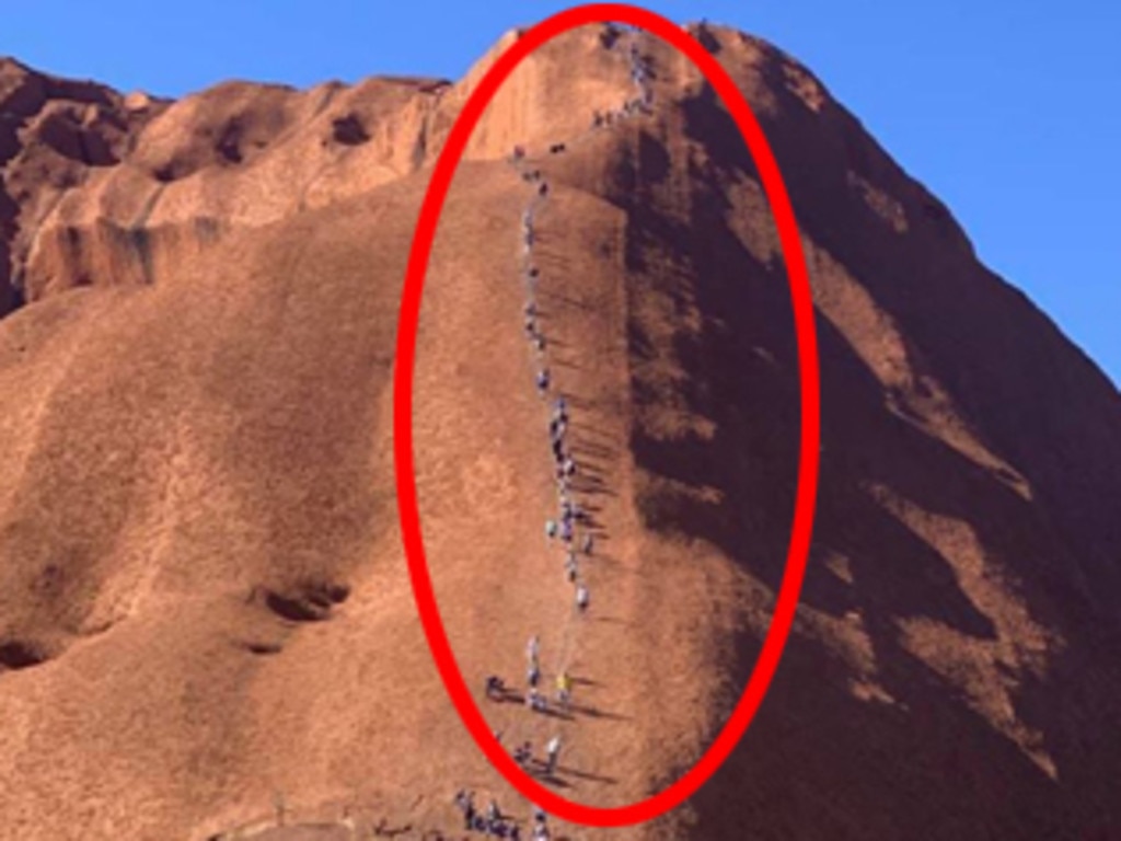 A picture of tourists climbing Uluru has left traditional landowners furious. Picture: ABC