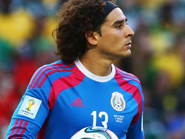 FORTALEZA, BRAZIL - JUNE 17: Guillermo Ochoa of Mexico holds the ball during the 2014 FIFA World Cup Brazil Group A match between Brazil and Mexico at Castelao on June 17, 2014 in Fortaleza, Brazil. (Photo by Robert Cianflone/Getty Images)