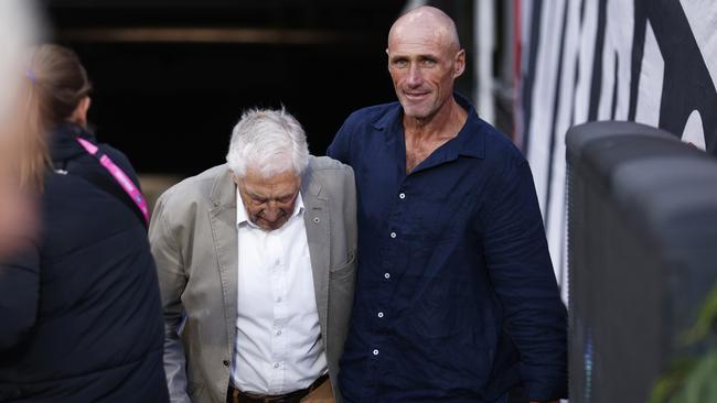 Tony Lockett (R) and Neil Roberts walk up the MCG tunnel arm in arm. (Photo by Daniel Pockett/Getty Images)