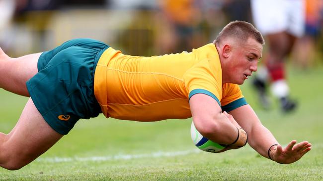 Australian U18s gun Kingsley Uys scores a try during the match against the New Zealand Barbarians at St Paul's Collegiate School in Hamilton. Picture: Phil Walter/Getty Images