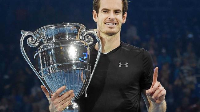 Britain's Andy Murray holds up the ATP world No.1 trophy following his win over Novak Djokovic in the men's singles final at the ATP World Tour Finals at the O2 Arena in London. Picture: ANDY RAIN