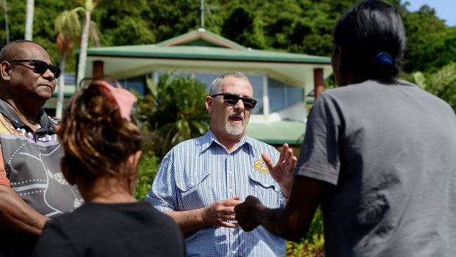 Yarrabah Shire Council CEO Richard Wright and mayor Ross Andrews meet the protesters outside the council's offices. Picture: Isaac McCarthy