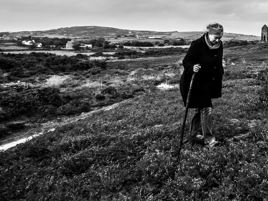 Landscape Photographer of the Year awards: Parys Mountain, Anglesey, Wales by Sam Rielly — Young Landscape Photographer of the Year 2014 ‘This image was taken on a particularly wet and windy day on Parys Mountain, the site of a former copper mine. The subject of the image is my mother, who was unaware that I was taking the picture.’ <a href="http://www.take-a-view.co.uk/" target="_blank">Find out more here. </a>